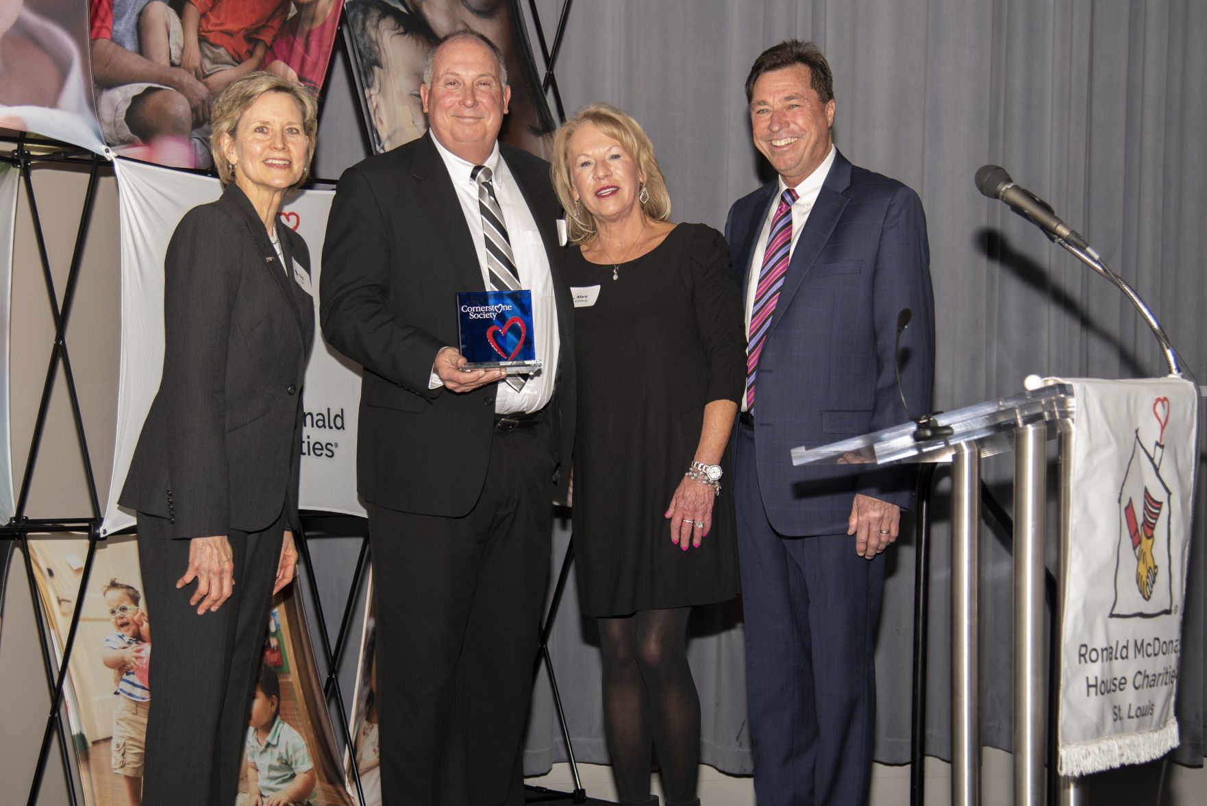 Ronald McDonald House Charities of St. LouisÕ Cornerstone Society Individual Award winners Mark and Mary Kohlberg, pictured with board chairperson Deb Vogt (left) and Dan Harbaugh, President of Ronald McDonald House Charities (right).